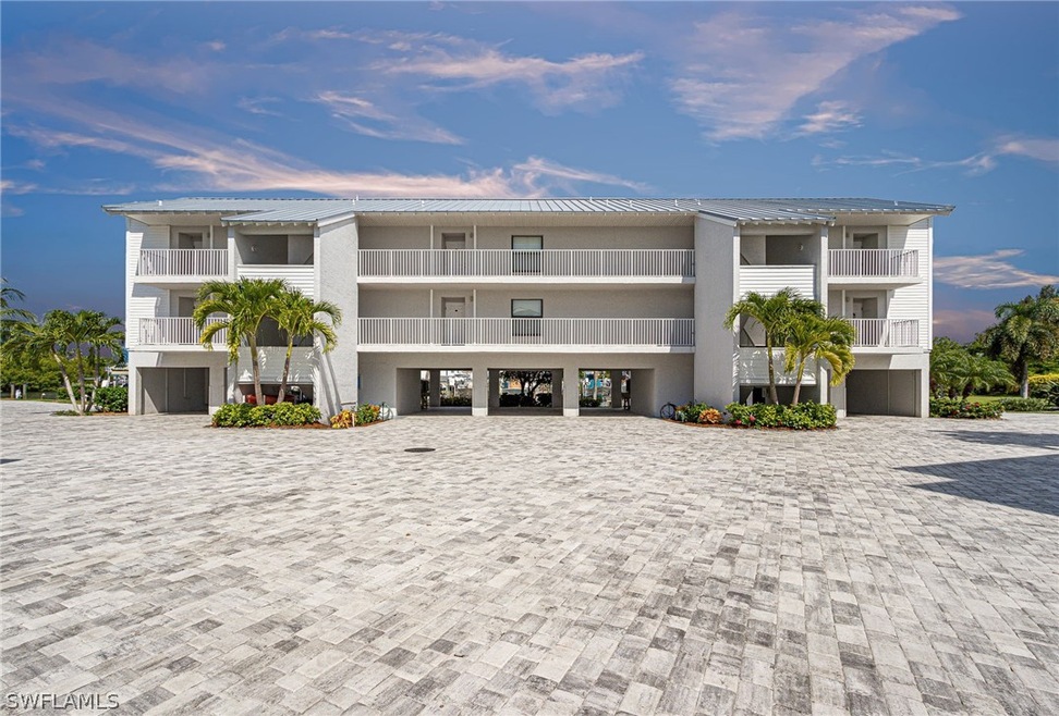 Under building parking.  Paver driveway.