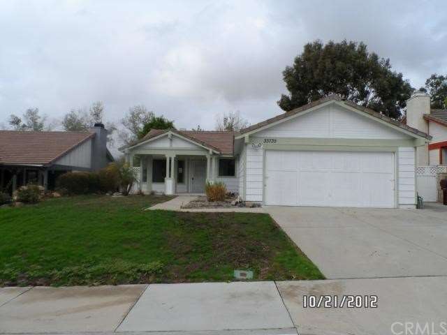 FRONT VIEW/ YARD JUST RESEEDED