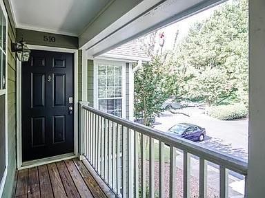View of exterior entry with a balcony