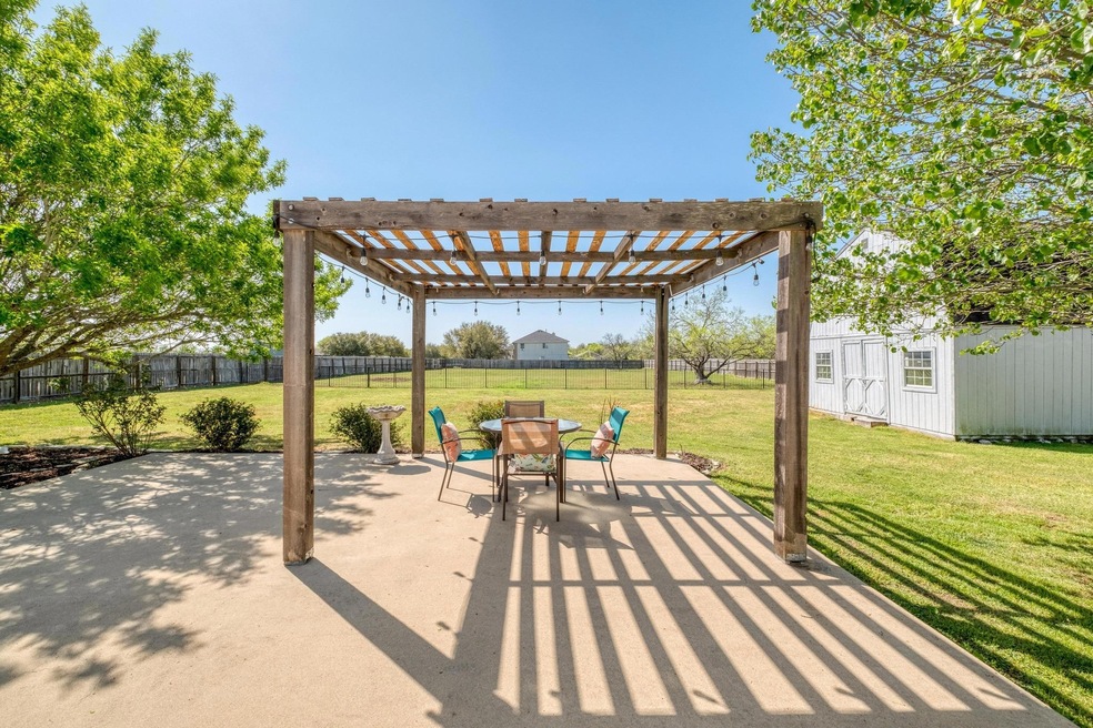 View of patio with a pergola, a fenced backyard, 