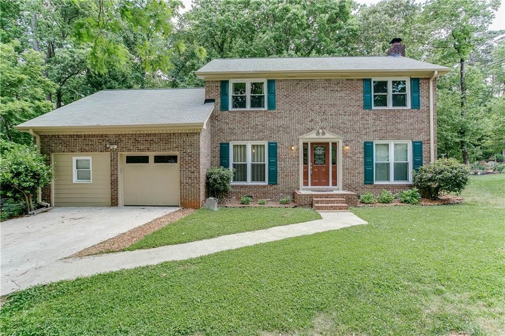 Gorgeous brick front home with maintainable lawn!