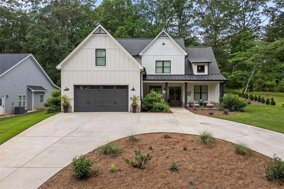 Welcome to 2490 S Carroll Ct – a custom home in a private, gated lake community
