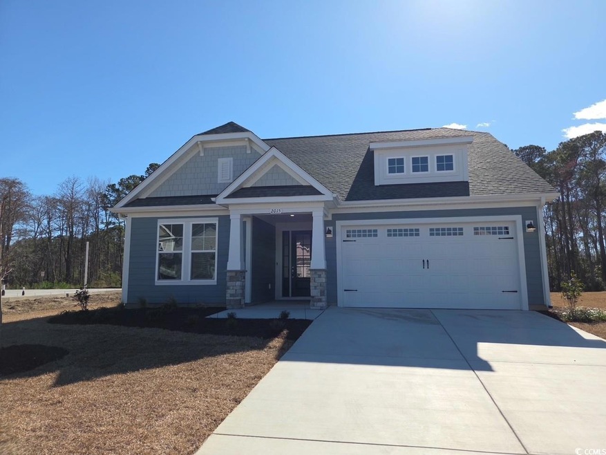 Craftsman house featuring a garage, stone siding, 