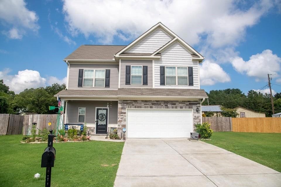 Craftsman-style house featuring a garage and a fro