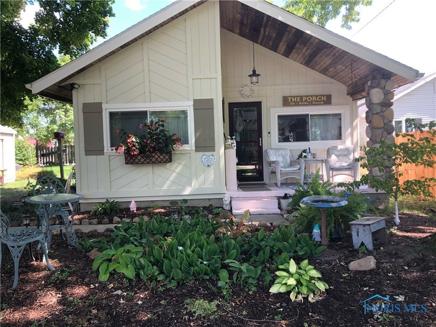 ADORABLE PORCH TO  SIT AND SIP YOUR COFFEE. IF IT