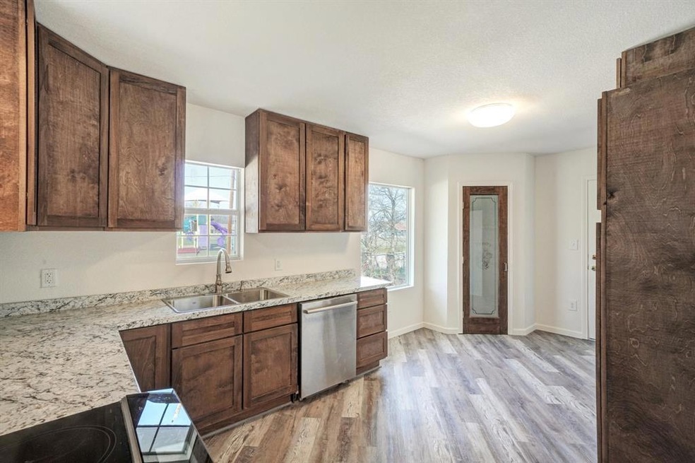 Large kitchen with nice pantry and room for a tabl