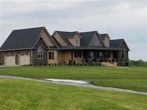 Beautiful Brick and Rock Facade accented with gorgeous stained cedar trim.