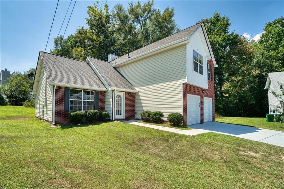 View of front of property featuring a garage and a