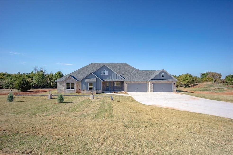 Craftsman-style home with a garage and a front law