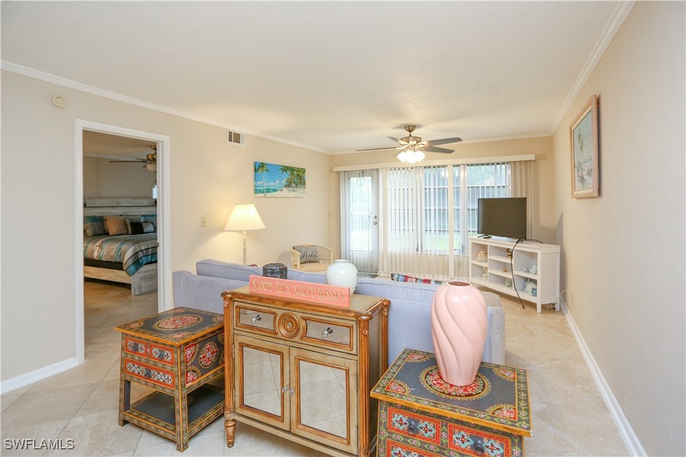 Living room featuring light tile patterned floorin