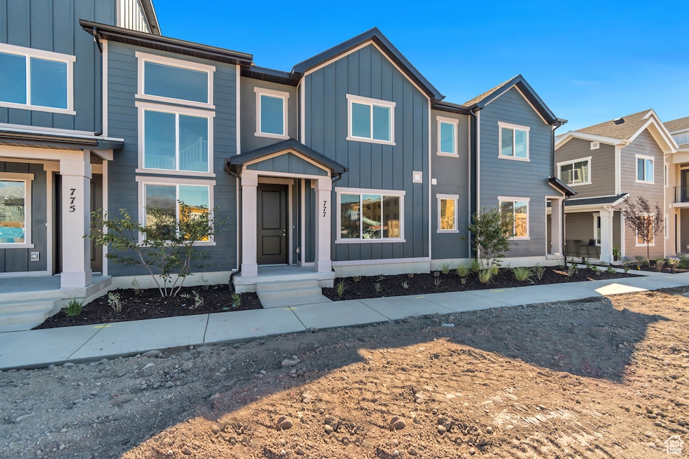 View of front of home featuring board and batten siding and a residential view