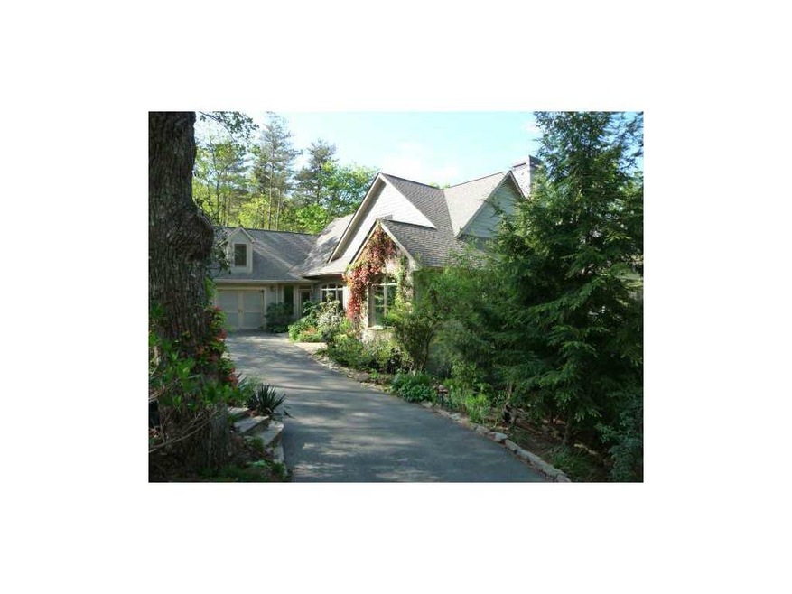 Exterior Front. Nestled into the landscaping, this
