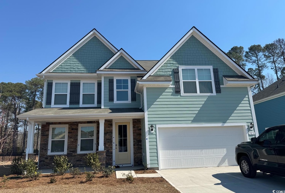 Craftsman inspired home with an attached garage, d