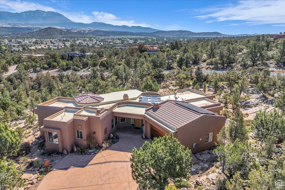 Birds eye view of property with a mountain view