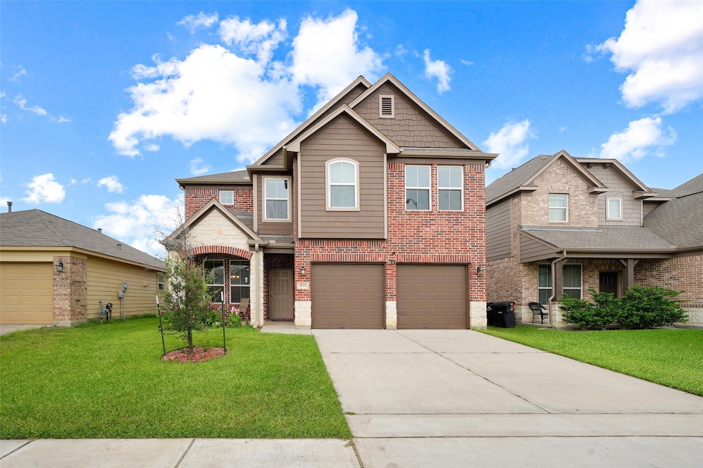 This is a two-story brick house with a modern desi