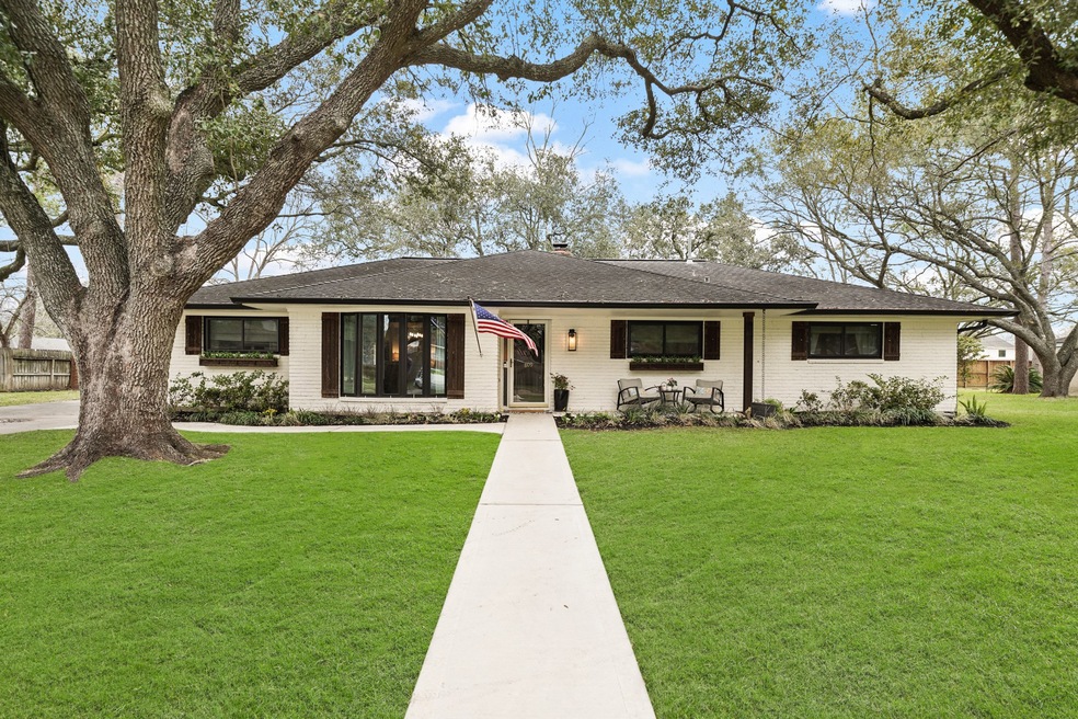 Situated on an over-sized wooded lot in the heart of Friendswood sits 809 Forest View Street. Remodeled throughout, interior walls have been reconfigured making for an open & flowing floor plan perfect for entertaining. Featuring a brick exterior, this home includes updated double-pane windows (2021) with decorative shutters, wood-stained planter boxes & professional landscaping including a sprinkler system. Paved walkways (2022) lead to the street & nearby driveway and a whole house generator is included.