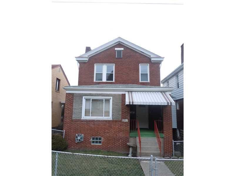 Exterior Front. The home has a level entry and fen