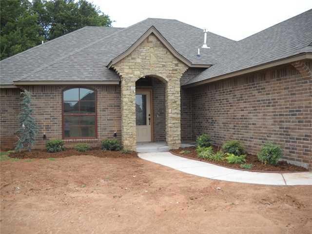 Exterior Front. Stacked stone, cedar, and red wind