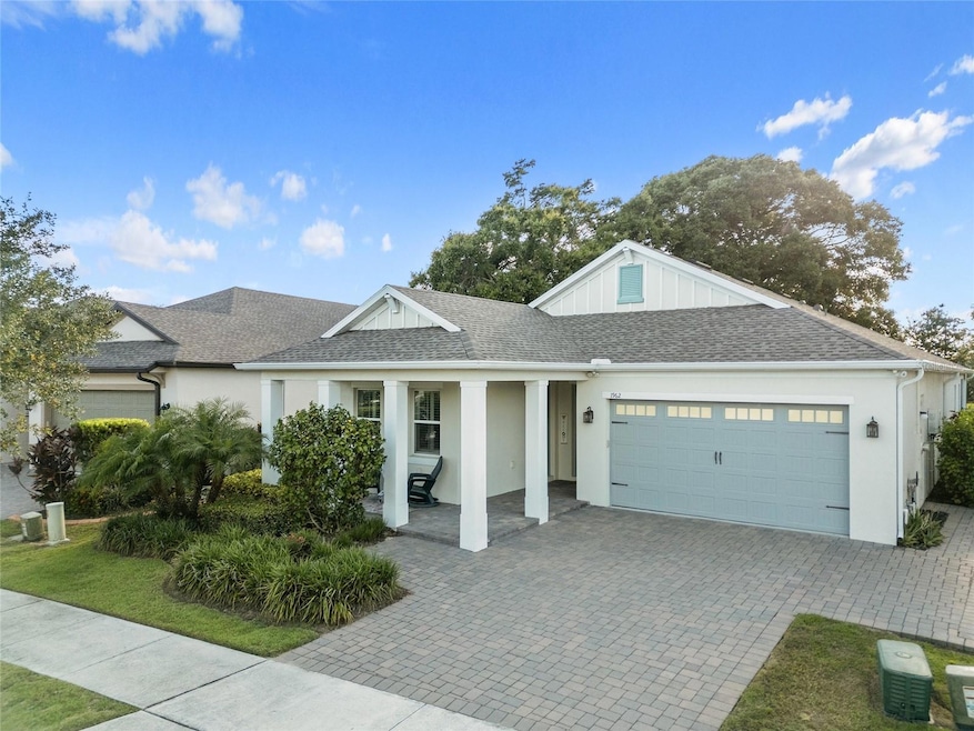 Charming front porch with lush landscaping curb appeal