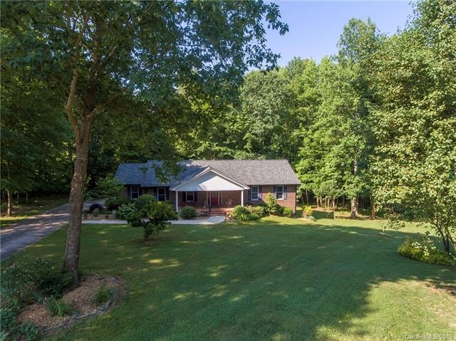 Large front yard on Cul-de-sac. Driveway continues around back to the 3rd garage bay.