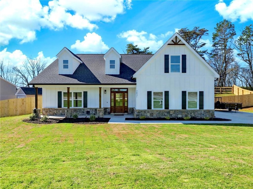 Modern inspired farmhouse featuring board and batt