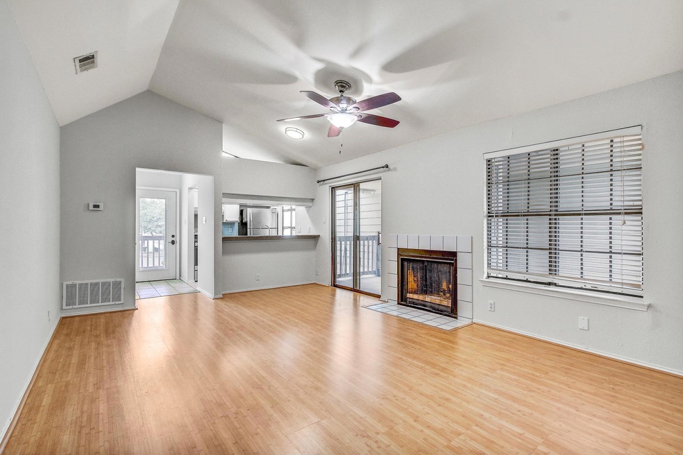 Unfurnished living room featuring ceiling fan, pl