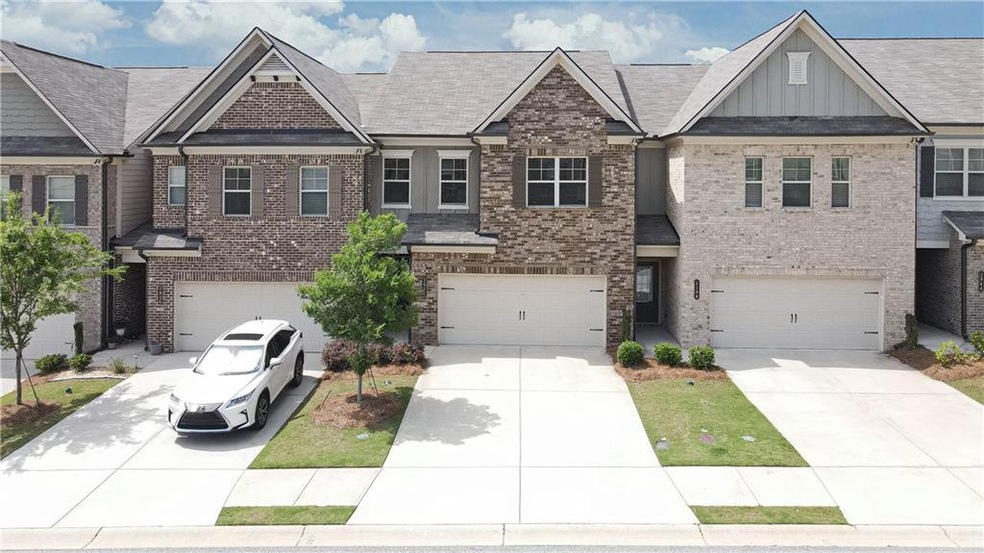 View of front of property featuring an attached ga