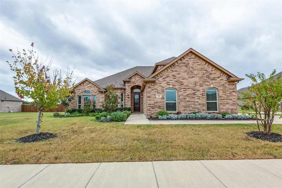 View of front of home featuring a large front lawn