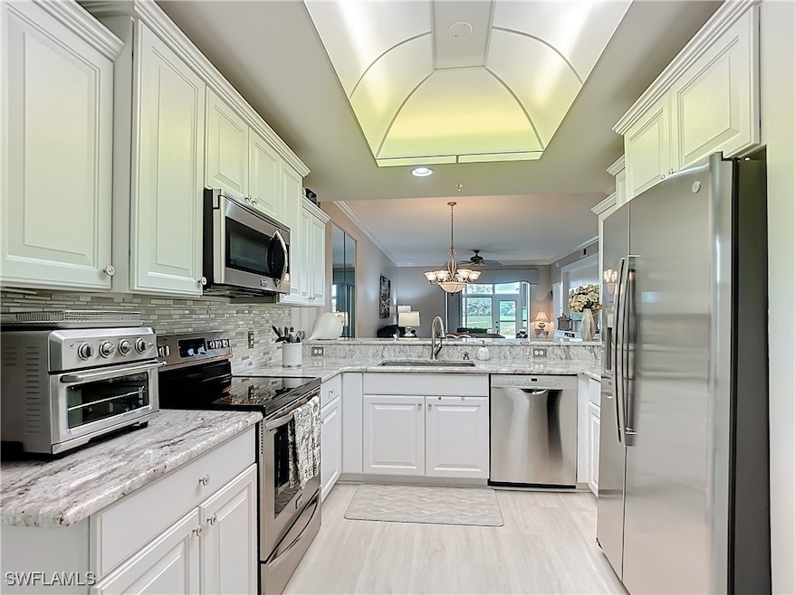 Kitchen with sink, stainless steel appliances, dec