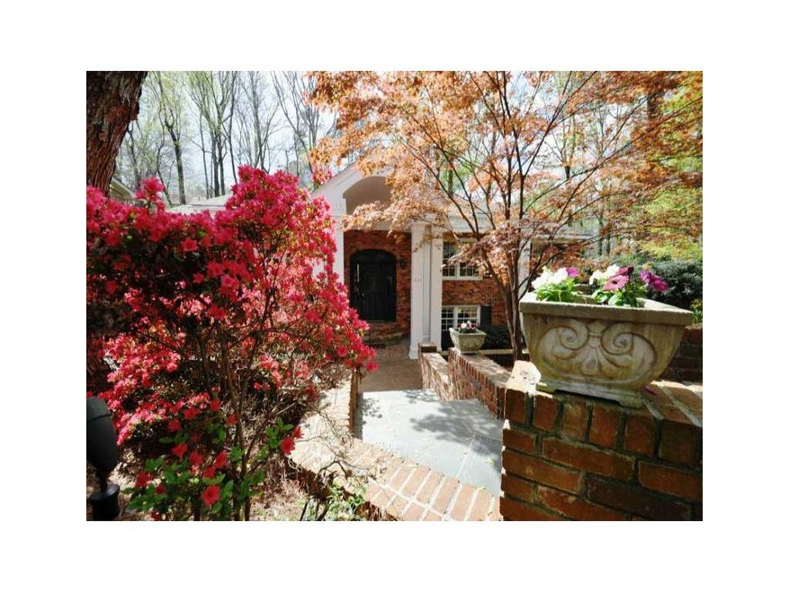 Exterior Front. A brick walkway leads from the str