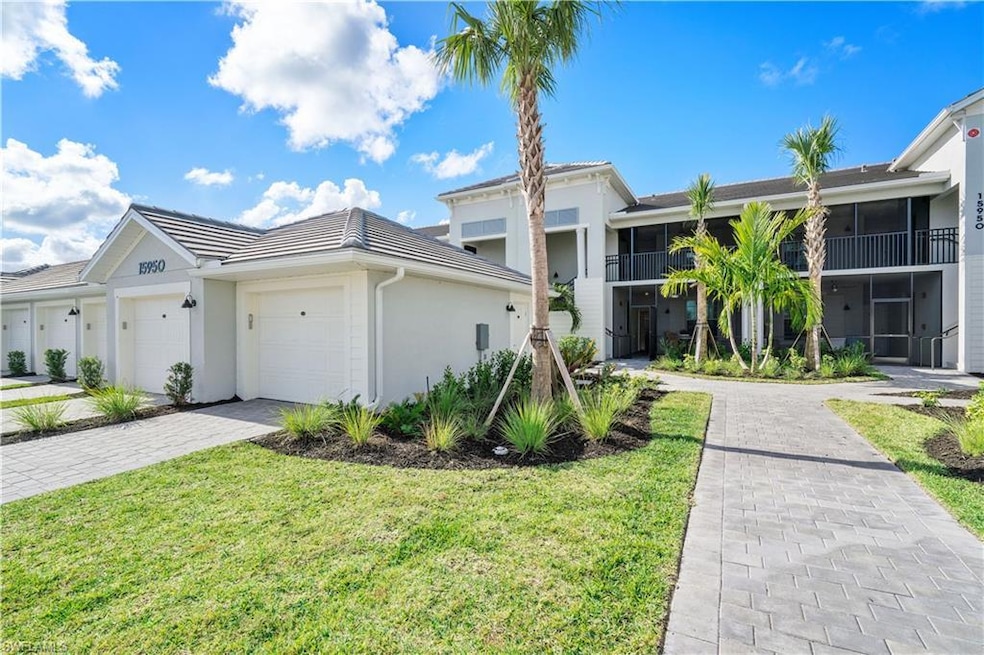 Multi unit property with a garage and a front lawn