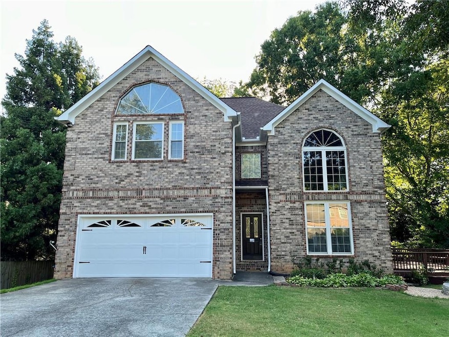 View of front of house featuring a garage and a fr