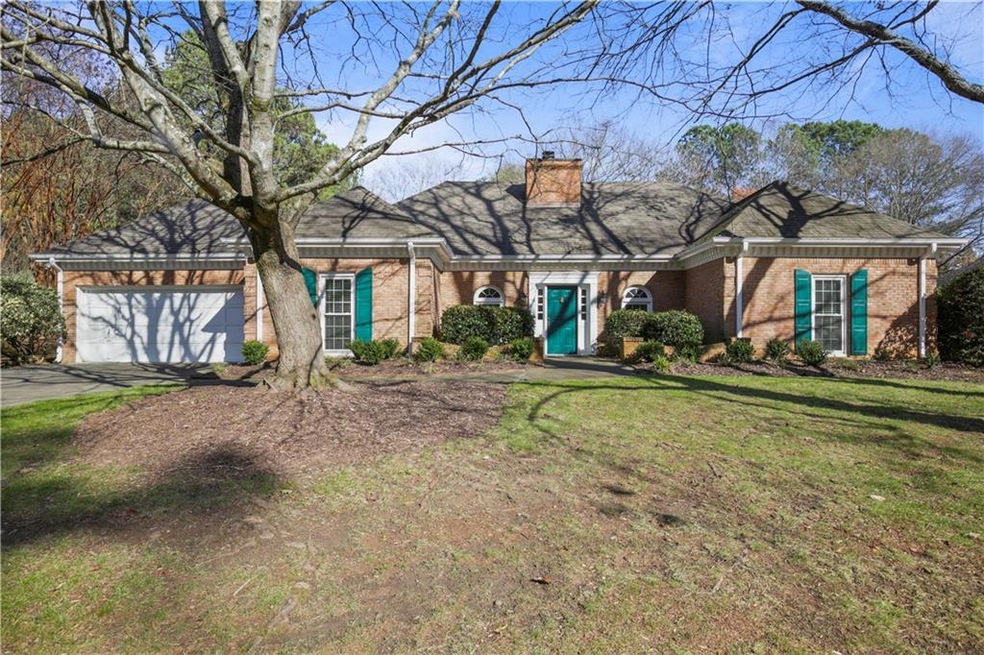 View of front of property with a garage and a fron