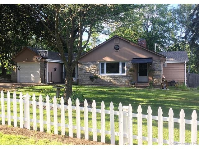 White picket fence! The stone facade with cedar sh