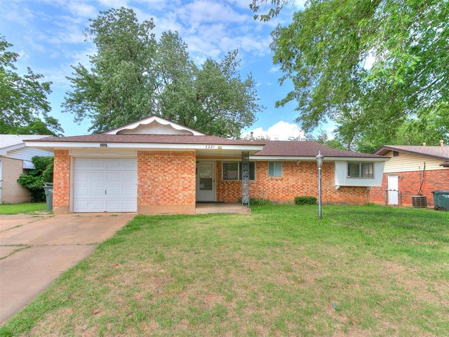 Single story home featuring a garage, central AC u