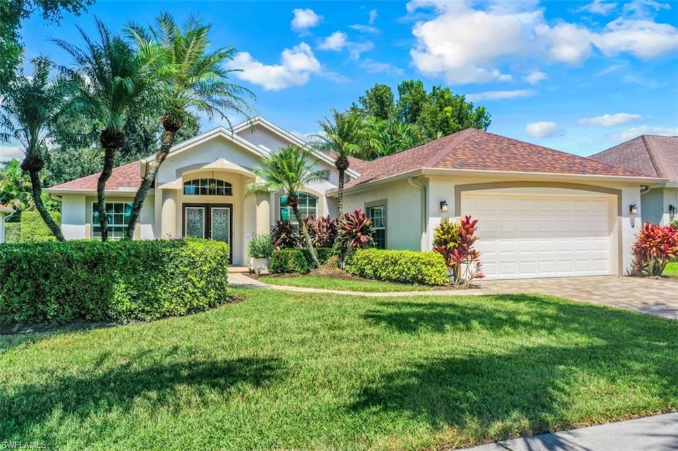View of front of property featuring a garage and a