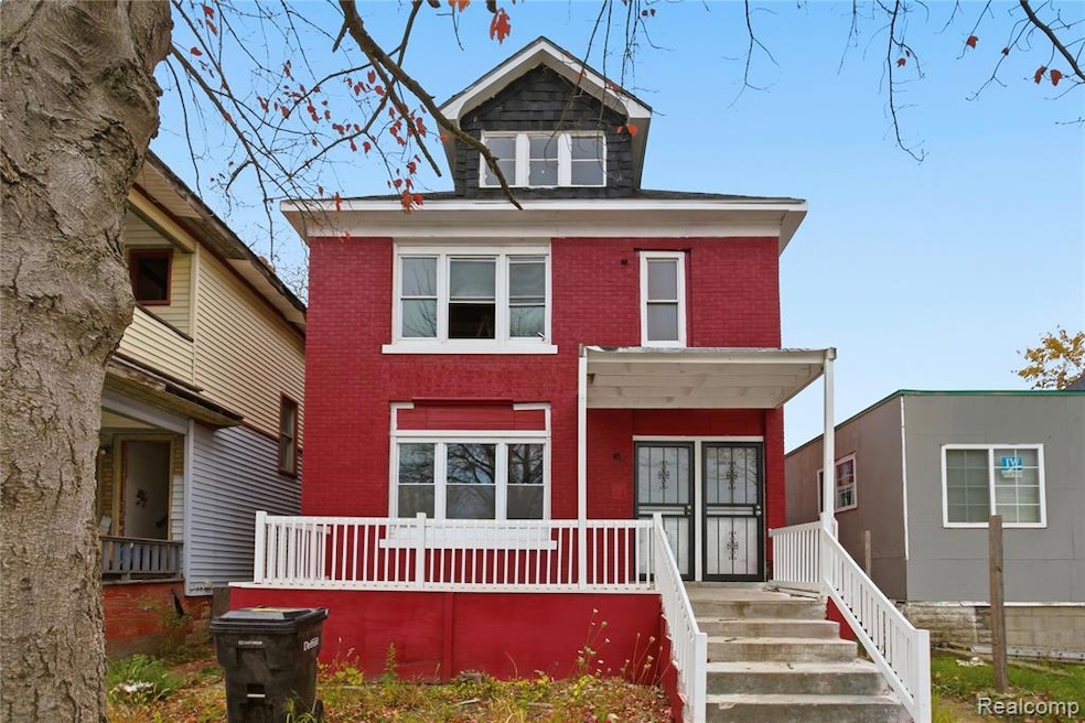 Traditional style home with a porch and brick siding