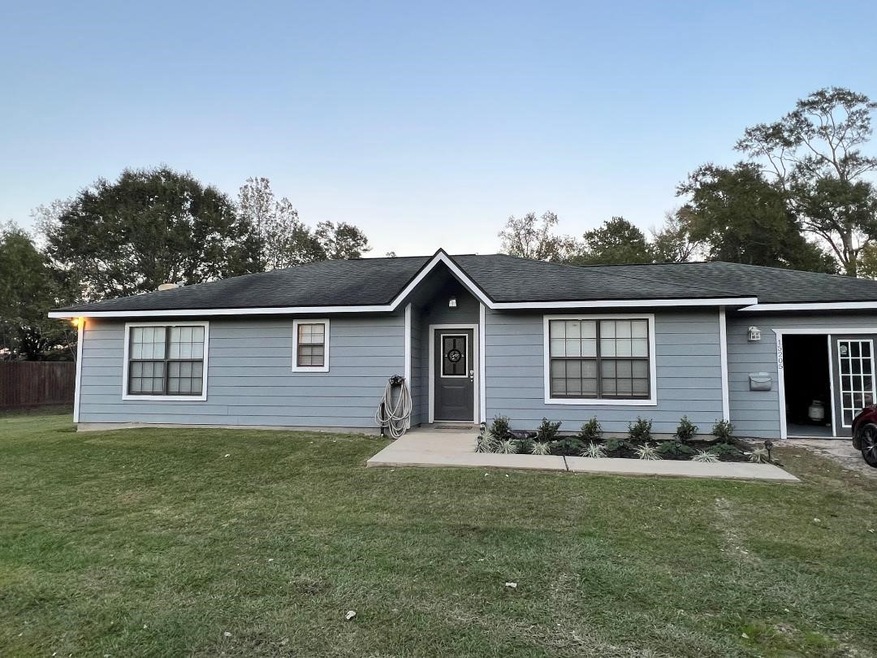 Welcome Home! New sod and appealing landscaping.