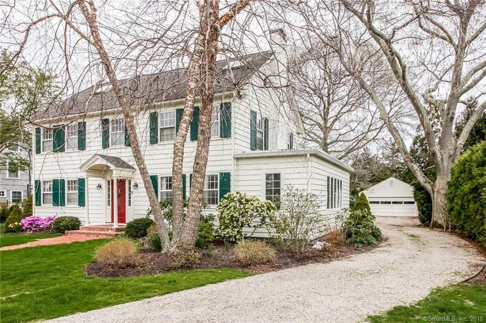 Front view showing driveway to 2 car garage