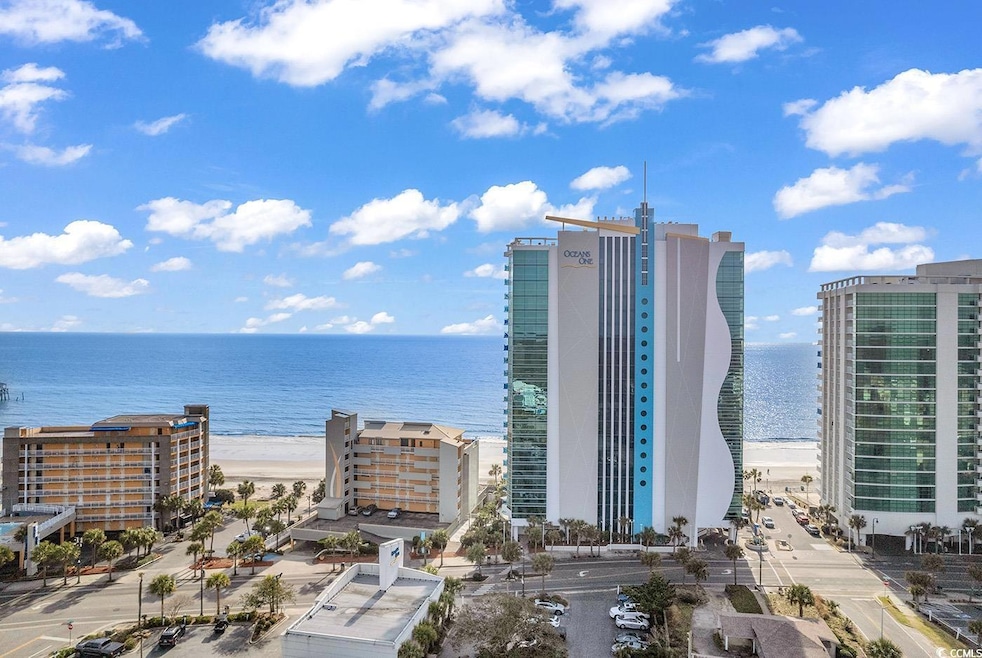 Drone / aerial view featuring a water view and a city view