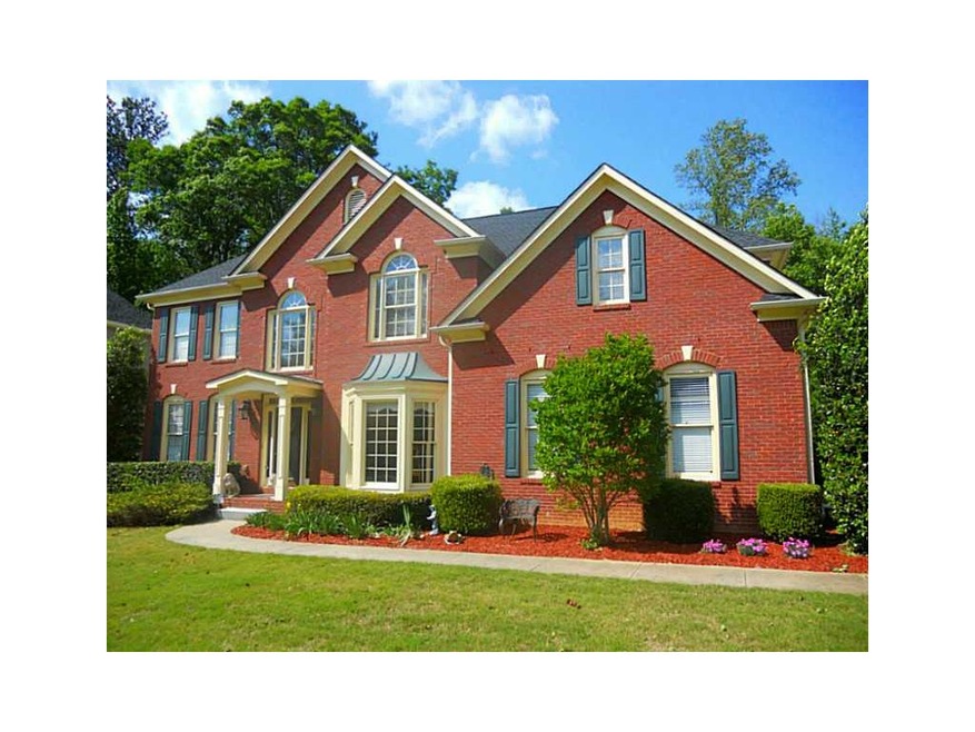 Exterior Front. Stunning brick home on lake in VER