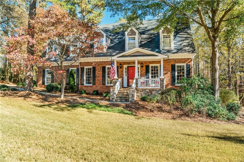 Charming cape cod with rocking chair front porch