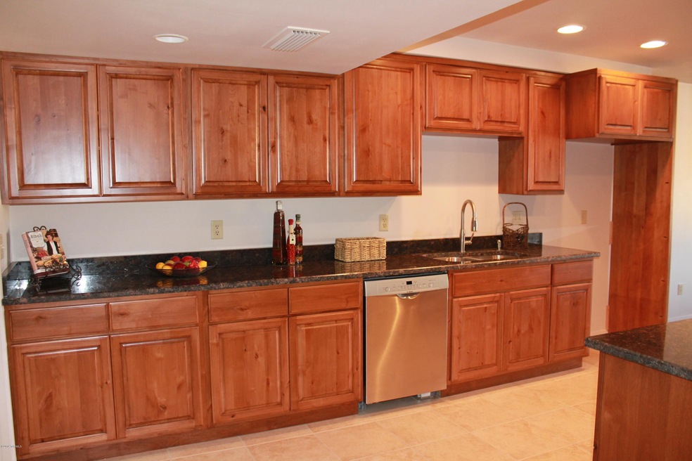 Kitchen with custom cabinets and granite