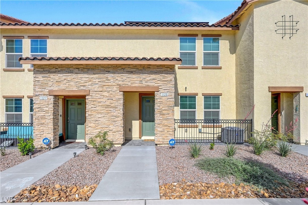 Multi-unit property featuring stone siding, stucco