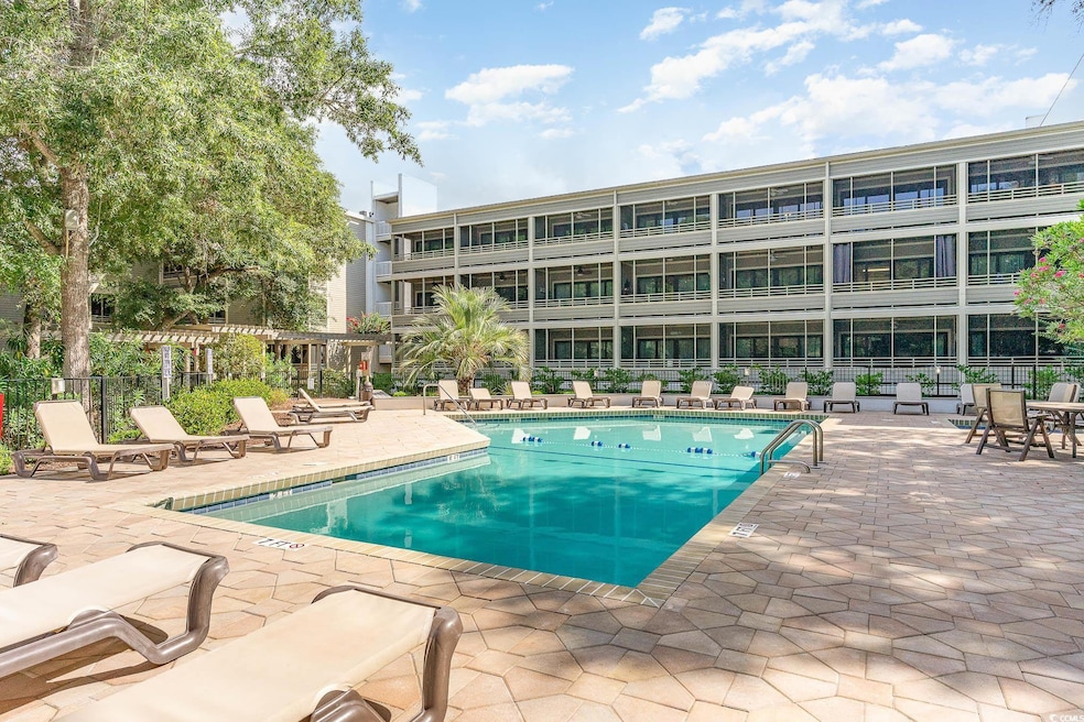 Community pool featuring a patio area