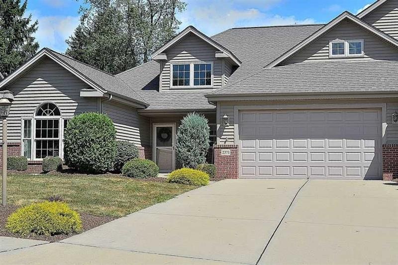 Exterior Front. This beautiful brick and vinyl pat