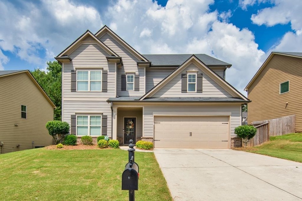 Gorgeous home with beautiful landscaping and a lev