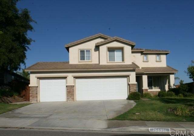 Front of Home with 3 Car Garage