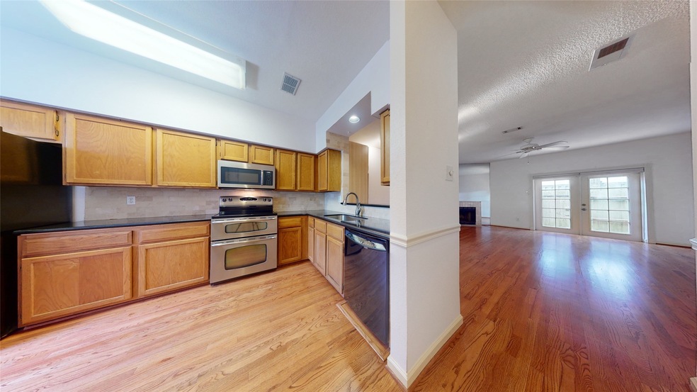 Expansive living room open to spacious kitchen