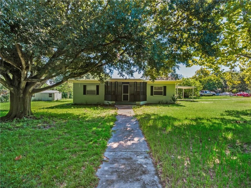 Front view of home with beautiful shading trees